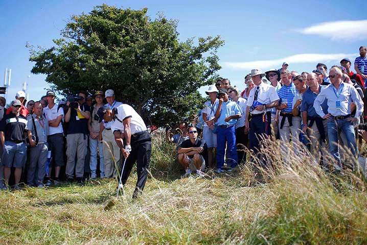 Open Golf : Tiger Woods of the U.S. plays his second shot from the rough