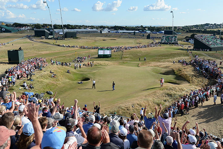 Open Golf : Tiger Woods of the United States celebrates a birdie on the 13th
