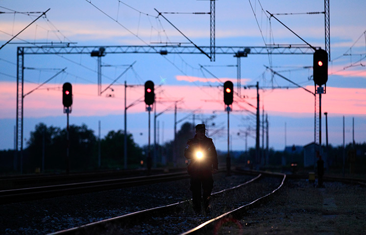 Croatia border patrols: A border police officer inspects the railway near the Croatia-Serbia border