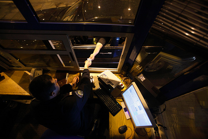 Croatia border patrols: A border police officer inspects documents at the border crossing in Bajako
