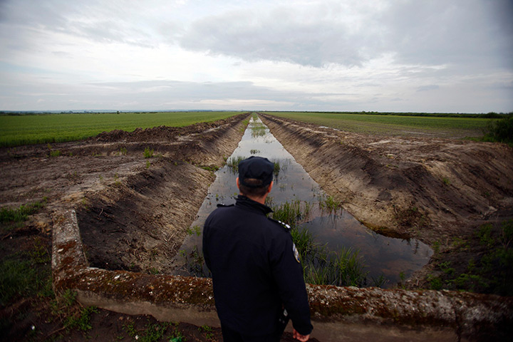 Croatia border patrols: A border police officer patrols the Croatia-Serbia border in Tovarnik, east