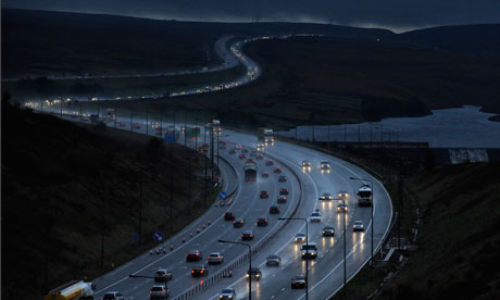 Night-time motorway traffic in wet weather