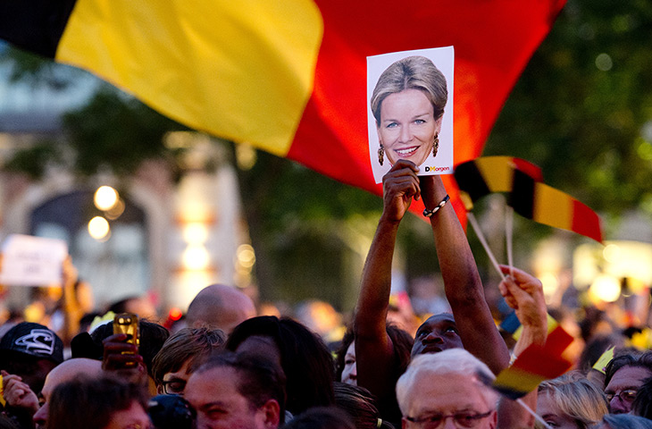 Weekend in pictures: Brussels, Belgium: A picture of Princess Mathilde is held aloft by wellwish