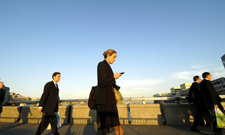 City office workers crossing London Bridge, England UK