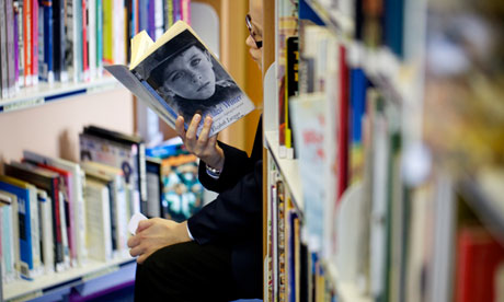 child reading in school library