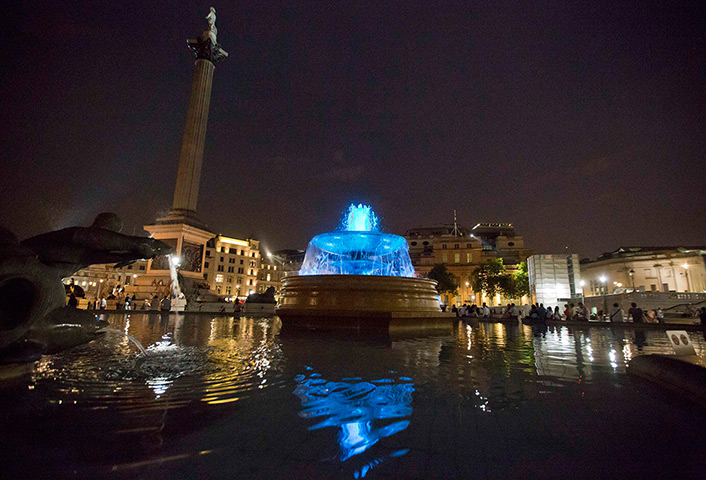 Royal blue: The fountains in Trafalgar Square are lit blue