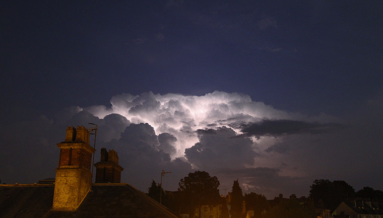 Stormy weather: Lighting illuminates the storm clouds over Tunbridge Wells in Kent