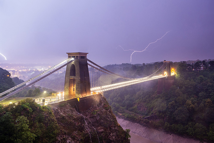 Stormy weather: The sky is filled with lightning behind the iconic Clifton Suspension Bridg