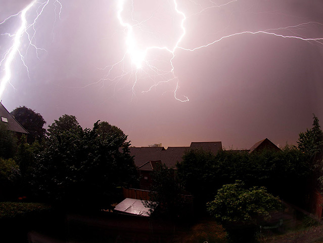 Stormy weather: Lightning flashes across the sky above Portishead, Bristol, in the early ho
