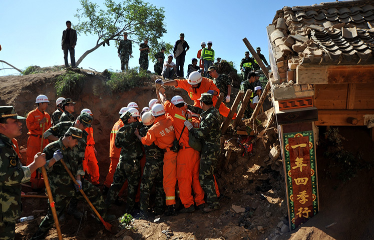 China earthquake: Rescuers work at quake-hit Yongguang Village 