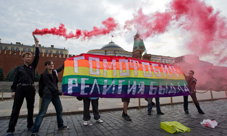 Gay rights activists hold a banner reading Homophobia - the religion of bullies in Red Square, Moscow Photograph: Evgeny Feldman/AP