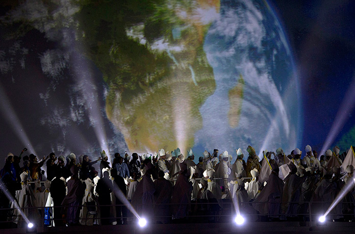 Pope in Brazil: Clergy stand during the World Youth Day inaugural Mass at Copacabana beach