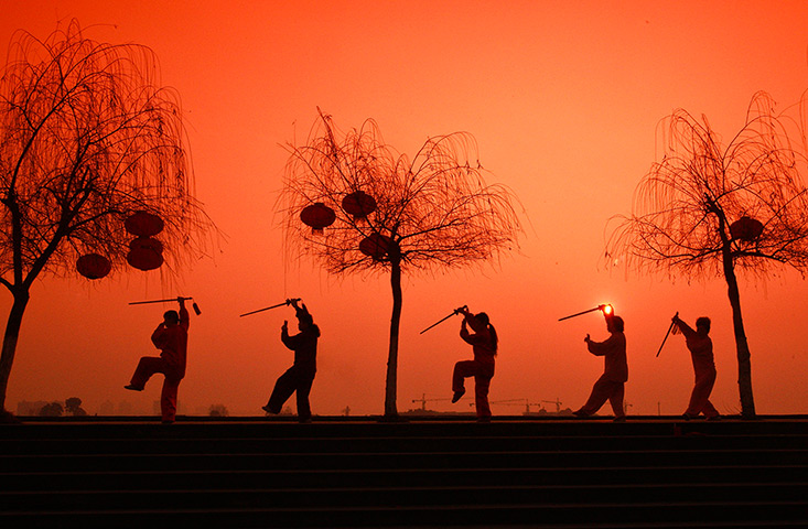 eyewitness tradition: Chinese women do morning exercises with swords in Suining