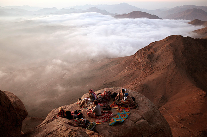 eyewitness tradition: Visitors watch the sunrise from Mount Moses in the Sinai Peninsula