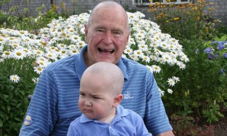 George Bush Sr with Patrick after having his head shaved. 