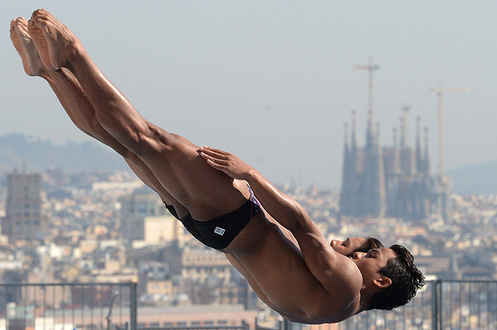 Divers underwater: Malaysia's Ooi Tze Liang and Ahmad Amsyar Azman compete in the men's 3-metr