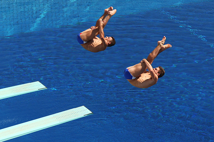 Divers underwater: Troy Dumais and Michael Hixon of USA compete in the Men's 3m synchro spring