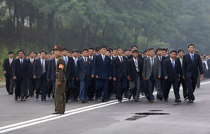 North Korea 60th: A North Korean soldier stands guard as people arrive for the opening ceremo
