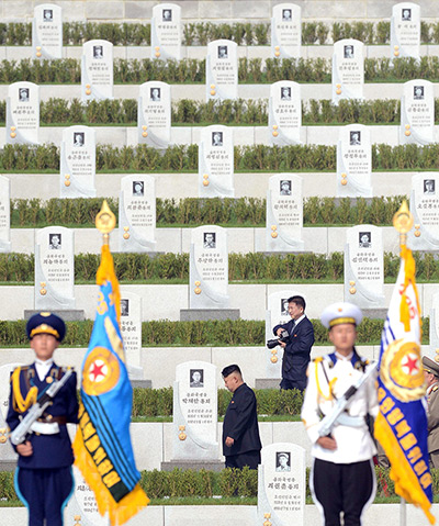 North Korea 60th: North Korean leader Kim Jong -un walks through the cemetery for Korean War 