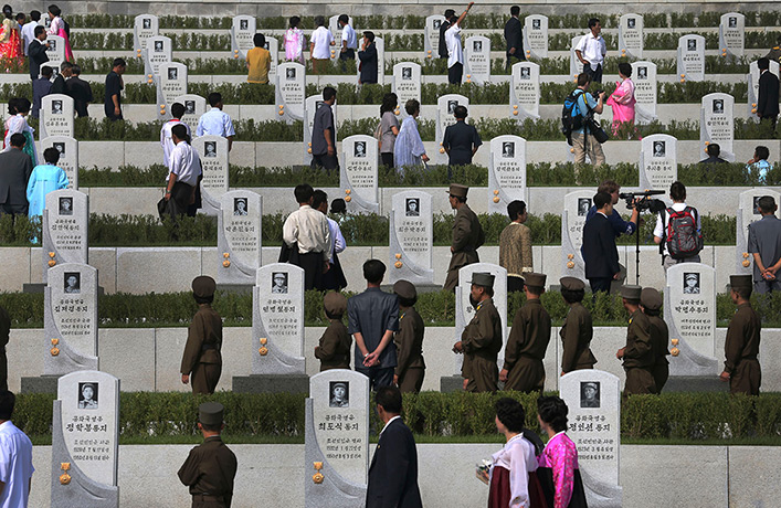 North Korea 60th: North Koreans walk among tombstones and pay their respects,at the cemeterie
