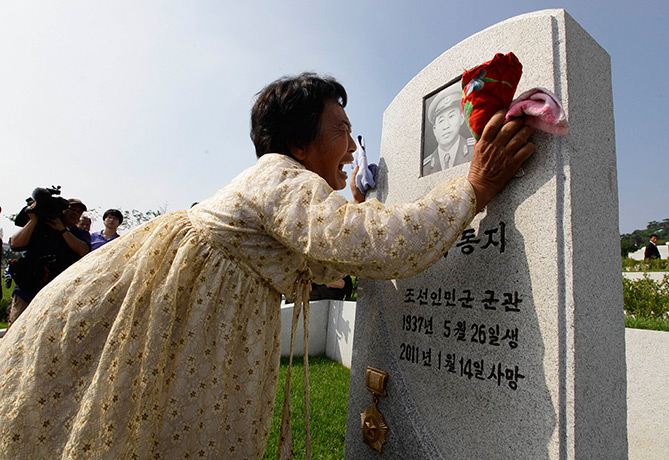 North Korea 60th: A North Korean woman Kim Bu-ok cries as she mourns her father in Pyongyang