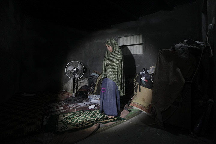 20 Photos: A Palestinian girl in the Nuseirat refugee camp in Gaza