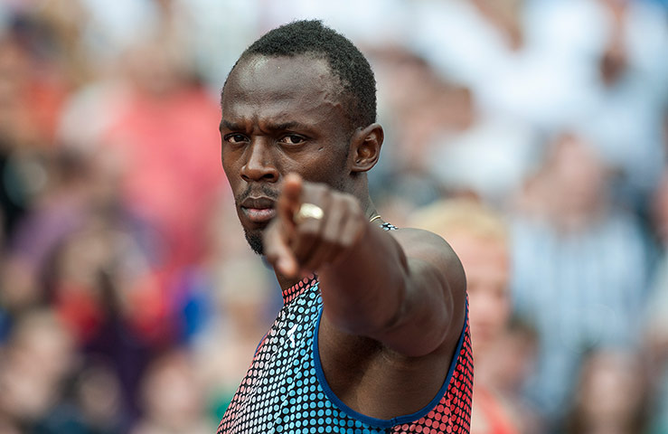 anniversary games: Usain Bolt points at Tom Jenkins