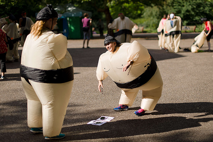 Weekend in pictures: London, UK: A participant attempts to pick up her number ahead of The Sumo 