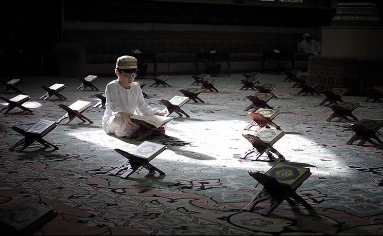 Weekend in pictures: Manama, Bahrain: A Shiite Muslim boy wearing traditional Bahraini dress rea