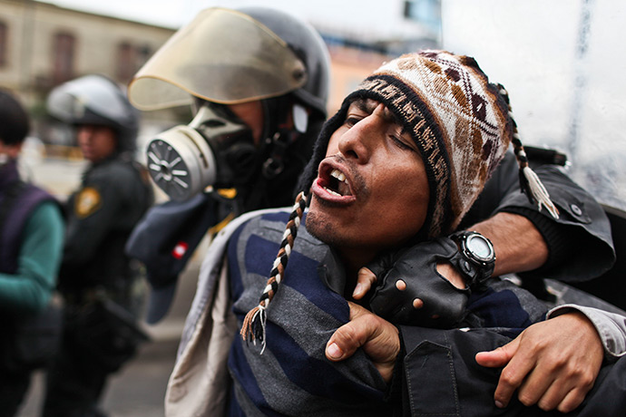 Weekend in pictures: Lima, Peru: A demonstrator is arrested by the police during a students and 