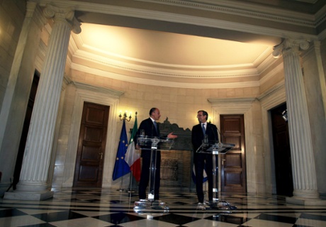 Greek Prime Minister Antonis Samaras (R) and his Italian counterpart Enrico Letta (L), address the media during a joint press conference following their meeting at the Prime Minister's office in Athens, Greece, 29 July 2013.