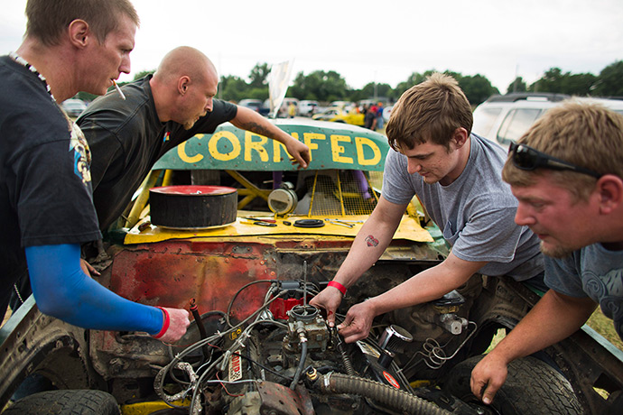 Iowa County Fair: Roger Zweck, Aaron Lemon, and Josh Roosa ready their car, which they gave t