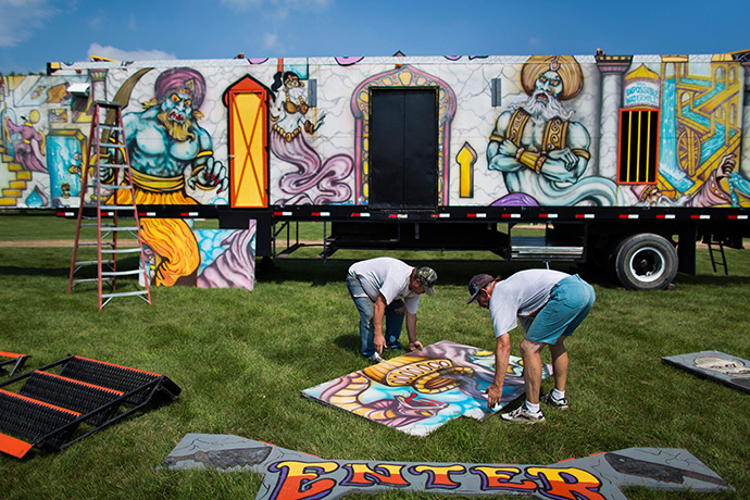 Iowa fair: Two employees of Jones & Company Carnival set up a haunted house called 'Th