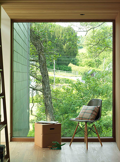 Homes - Welsh House: chair with cushion and box in front of window