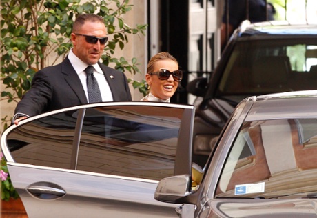 Francesca Pascale, the girlfriend of Italian former Premier Silvio Berlusconi, leaves his residence in Rome, Tuesday, July 30, 2013. Berlusconi is waiting in his home in Rome for the decision that will change his political fate as Italy's highest court hears arguments in the former premier's fraud conviction.