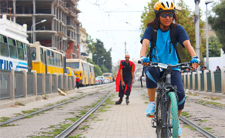 connect4climate: Lady riding bike