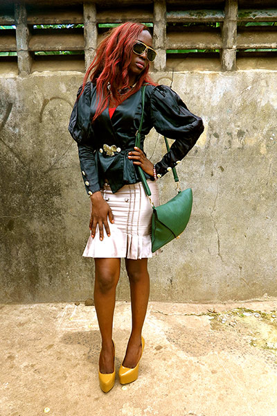 Big Picture - Africa: woman in black shirt and beige coloured skirt 