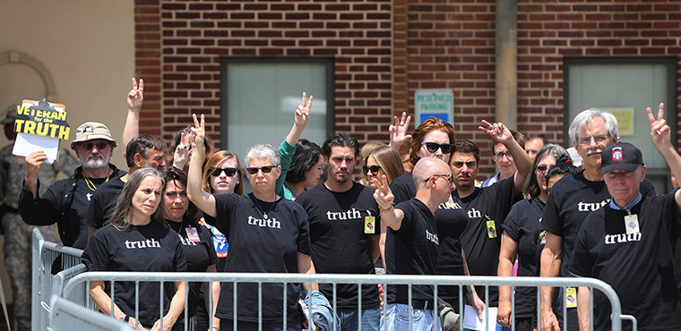 Bradley Manning protests: Supporters gesture outside the courthouse at Fort Meade, Maryland 