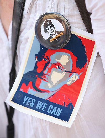 Bradley Manning protests: An activist wears pictures of whistleblowers Edward Snowden and Bradley Man