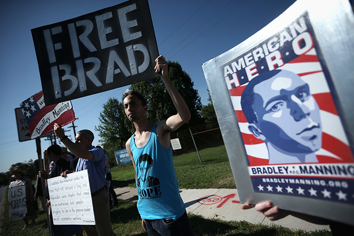Bradley Manning protests: Supporters hold signs to show support during a demonstration outside the ma