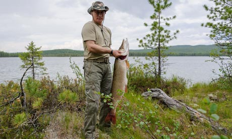 Vladimir Putin with his big catch – but many questioned whether it was really 46lb, as he claimed, and even whether he really landed it all. Photograph: Alexey Druzhinin/AFP/Getty Images