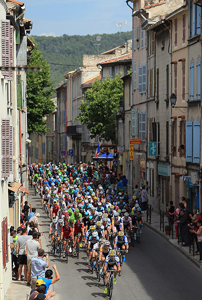 Tour de France stage 5: The peloton passes through town as they approach the final climb of the day