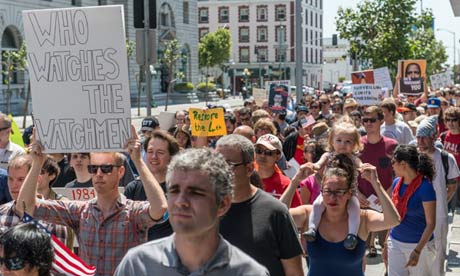 The march passes the San Francisco Federal Building. Photograph: Justin Benttinen