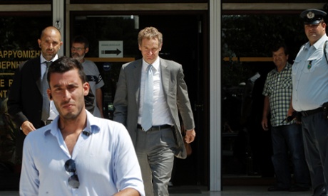 International Monetary Fund's (IMF) Deputy Director and Mission Chief to Greece Poul Thomsen (C) leaves the Administrative Reform ministry in Athens July 5, 2013.