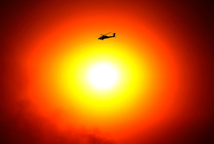 Egypt Day 3: Egyptian military attack helicopter flies by the Presidential palace