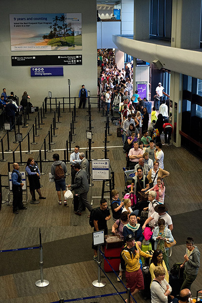 Asiana plane crash: United Airline passengers wait in long queues to rebook flights at San Fran