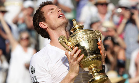 Andy Murray holds the Wimbledon winner's trophy