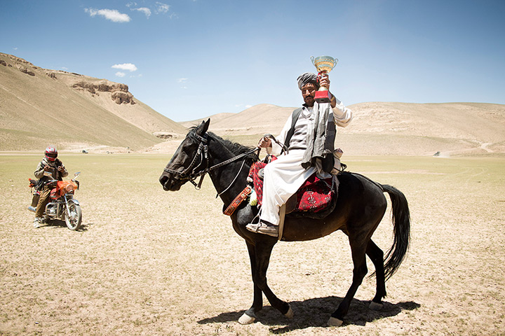 Silk Road Festival: The Buzkashi winner with his team's trophy, near Yakawlang, during the 5th 