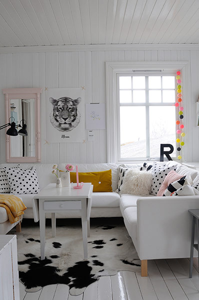 homes - norway house: white room with white sofa and animal skin rug