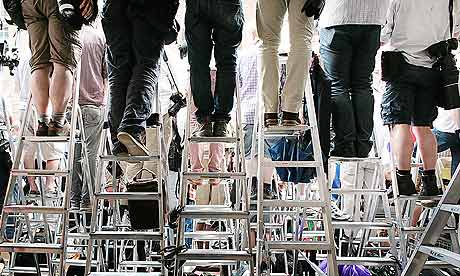 Photograhers waiting outside hospital for royal baby birth, stood on step ladders